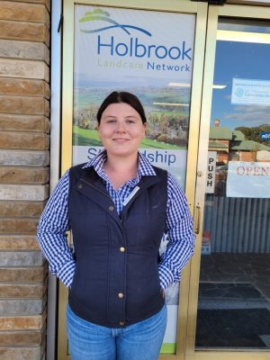 Jess Armstrong (Community Engagement Officer and Knowledge Broker) standing out the front of the Holbrook Landcare Network Office